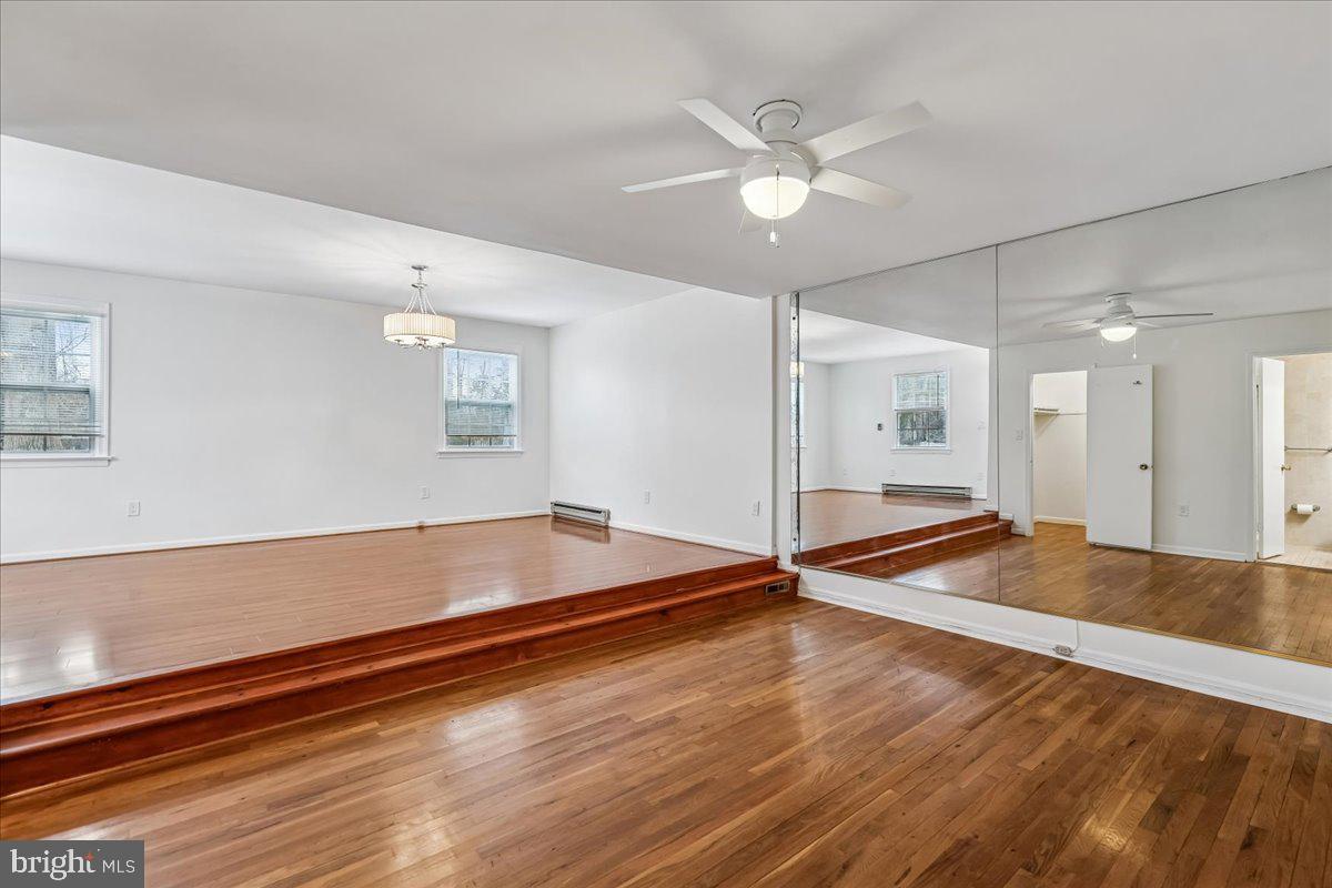 1521 Billman Lane Silver Spring, MD 20902 - Photo 17 of 33 a view of room with wooden floor and fan