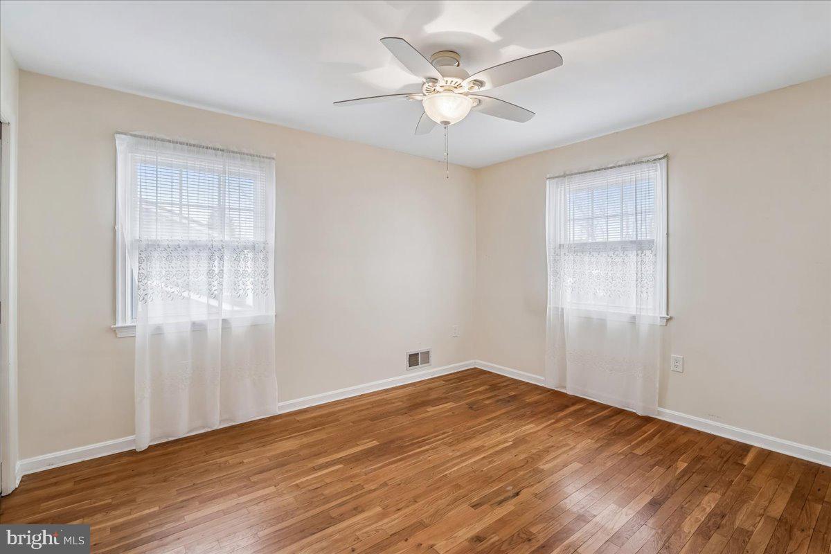 1521 Billman Lane Silver Spring, MD 20902 - Photo 22 of 33 a view of an empty room with wooden floor