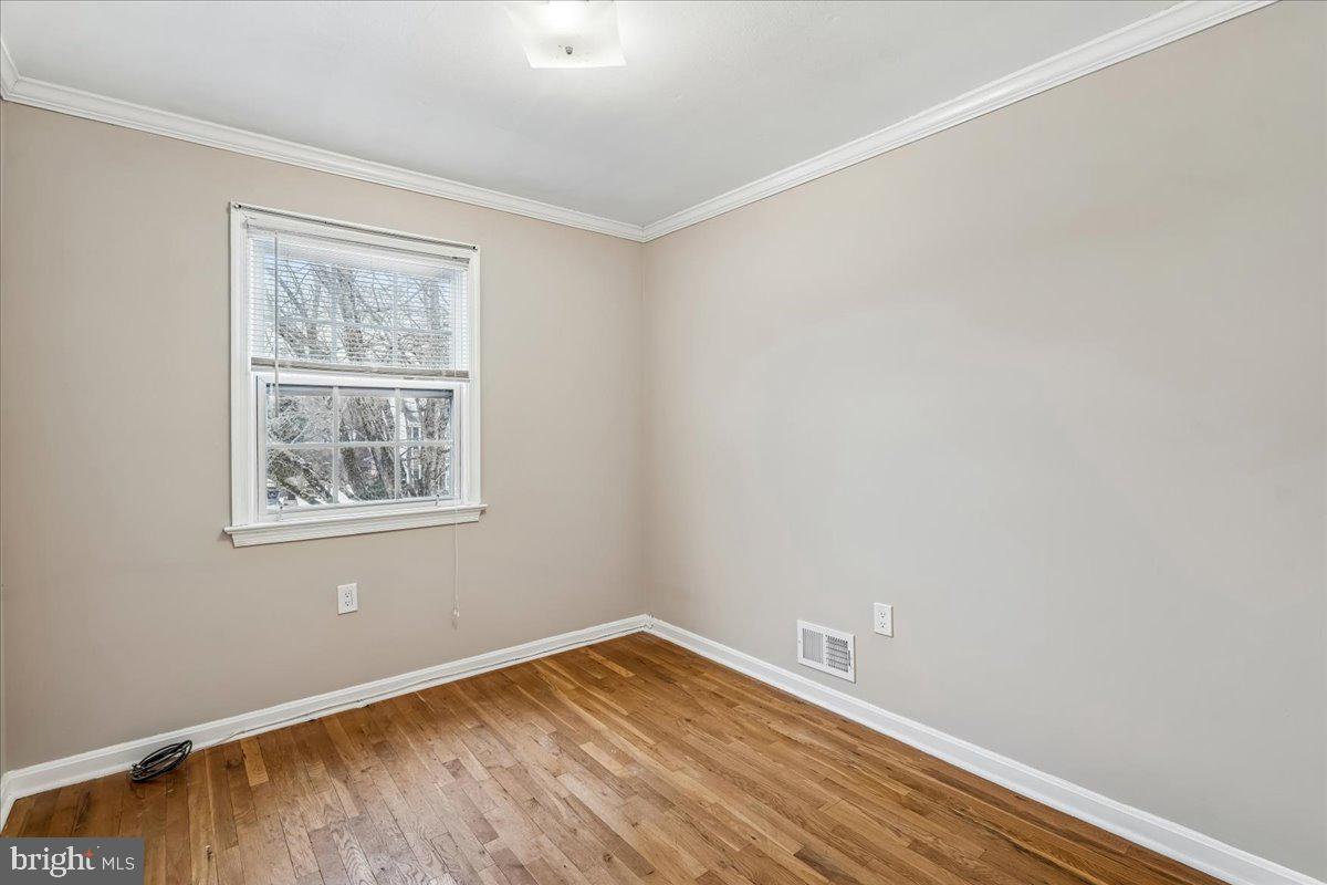 1521 Billman Lane Silver Spring, MD 20902 - Photo 23 of 33 an empty room with a window