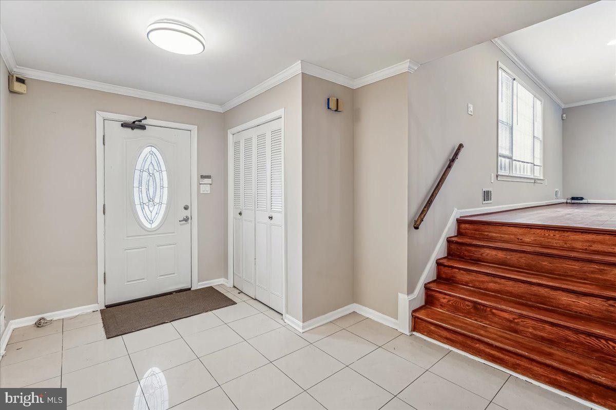 1521 Billman Lane Silver Spring, MD 20902 - Photo 6 of 33 a view of entryway with stairs and wooden floor