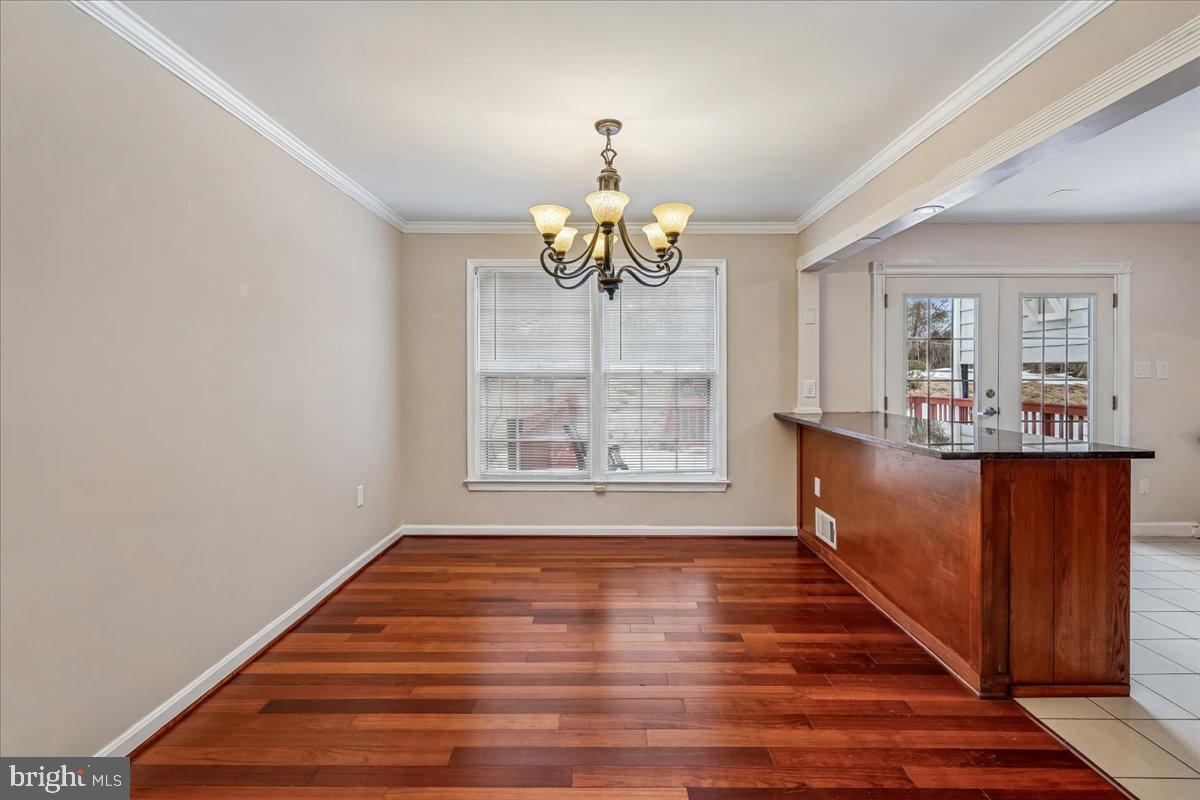 1521 Billman Lane Silver Spring, MD 20902 - Photo 9 of 33 a room with wooden floors pool table and window