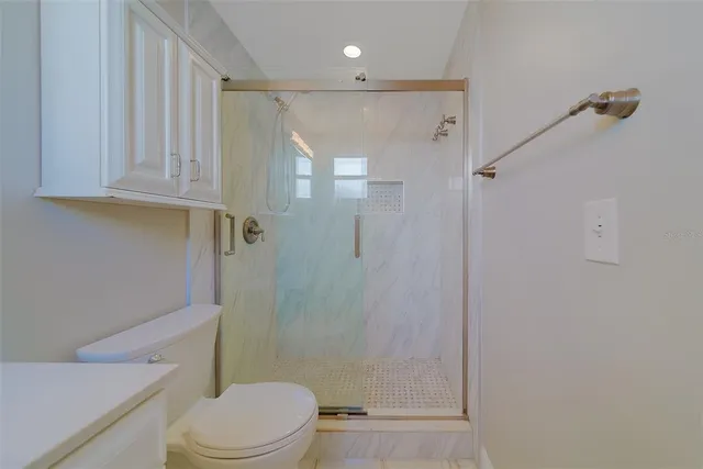 a kitchen with refrigerator cabinets dining table and chairs