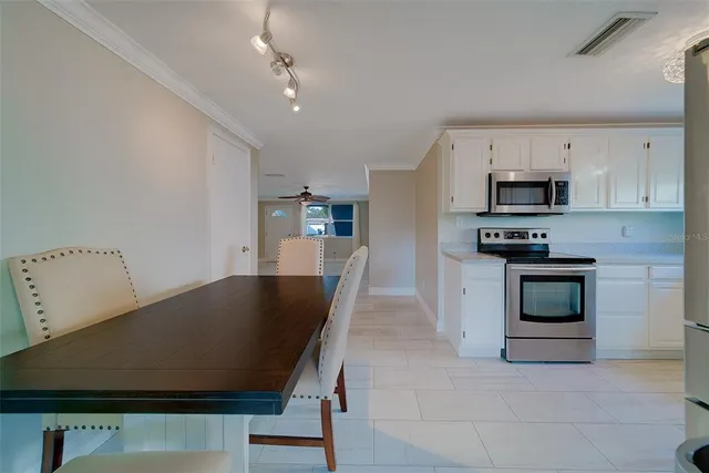 a kitchen with appliances cabinets and a sink