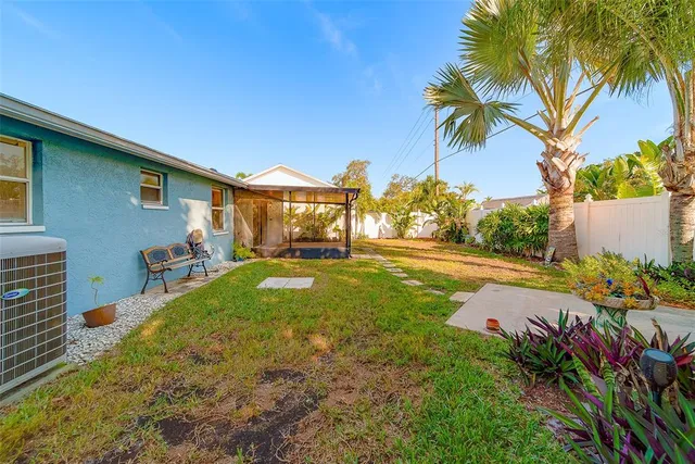 an aerial view of a house with a yard and fountain