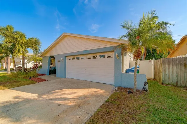 an aerial view of multiple houses with yard