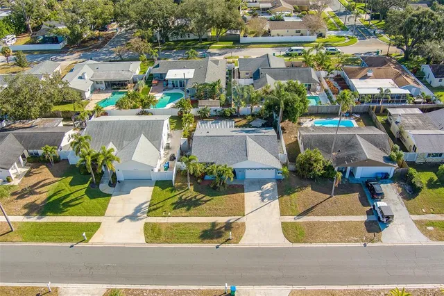 an aerial view of residential building and ocean