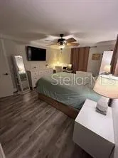 a living room with furniture and flat screen tv