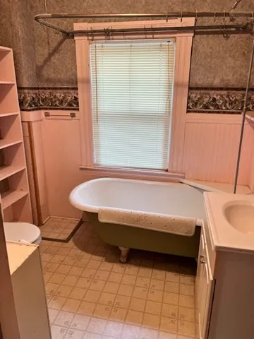 a bathroom with a sink and a shower