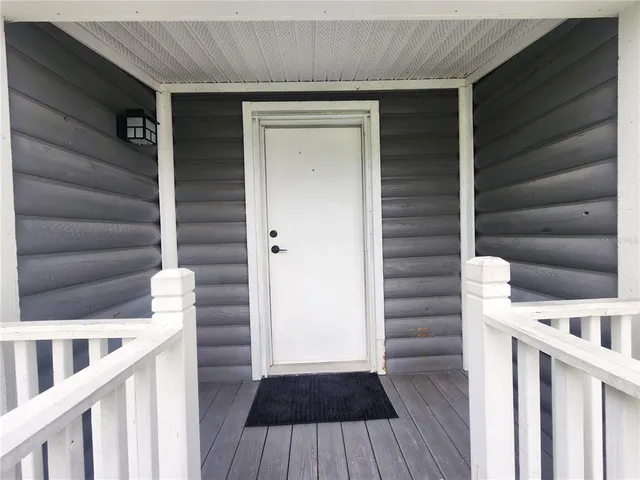 a room with furniture and wooden floor
