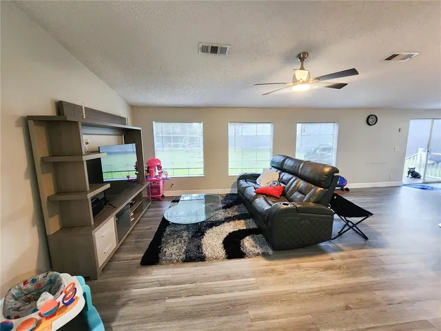 a kitchen with stainless steel appliances a stove a refrigerator and cabinets