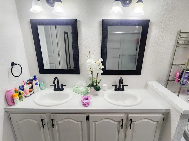 a view of kitchen with furniture and refrigerator