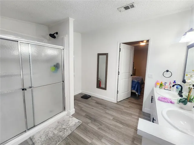 a view of backyard with swimming pool and green space