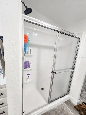 an aerial view of a house a yard and a lake view