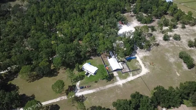 a swimming pool with an outdoor space and seating area