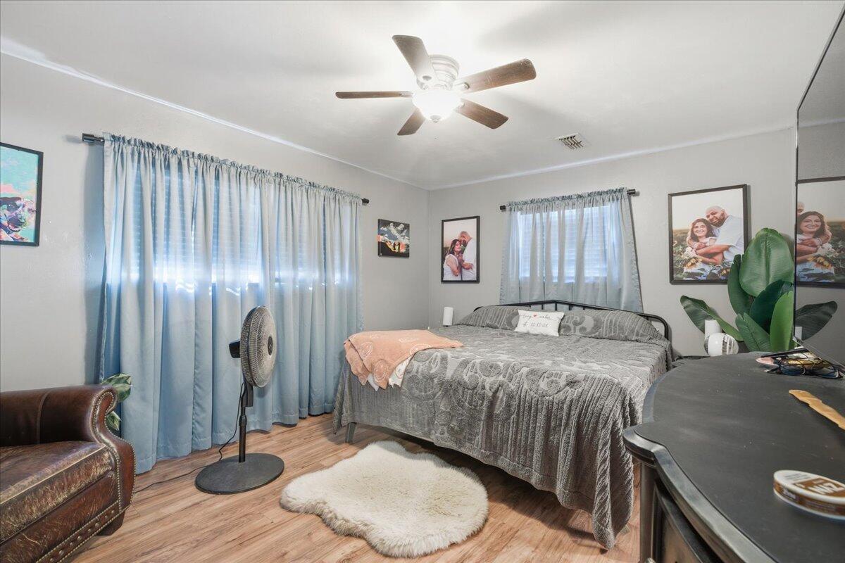 3816 44th Street Lubbock, TX 79413 - Photo 12 of 36 a bed room with a bed and furniture