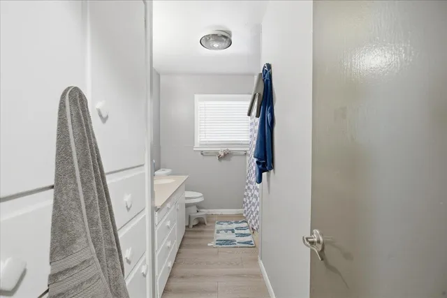 a view of a hallway with windows and stairs