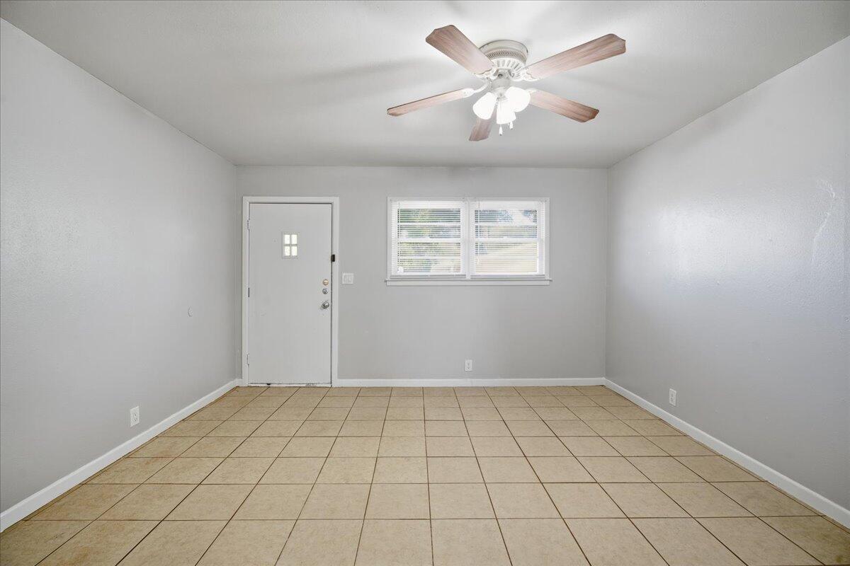 3816 44th Street Lubbock, TX 79413 - Photo 24 of 36 wooden floor in an empty room with a window