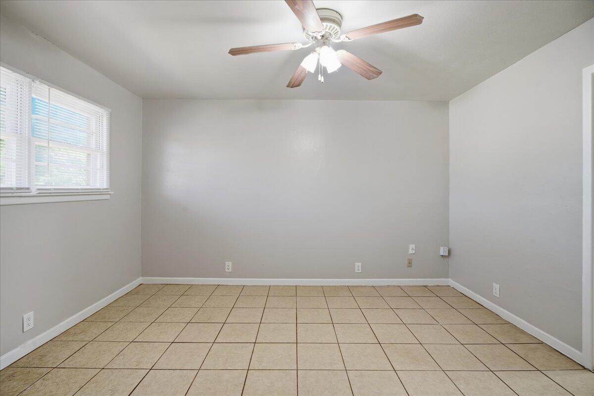 3816 44th Street Lubbock, TX 79413 - Photo 25 of 36 wooden floor in an empty room with a window