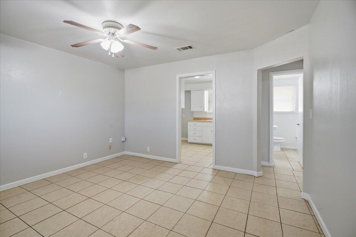 3816 44th Street Lubbock, TX 79413 - Photo 26 of 36 an empty room with chandelier fan