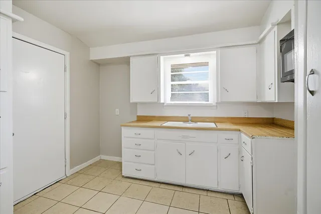 a view of a kitchen with a sink