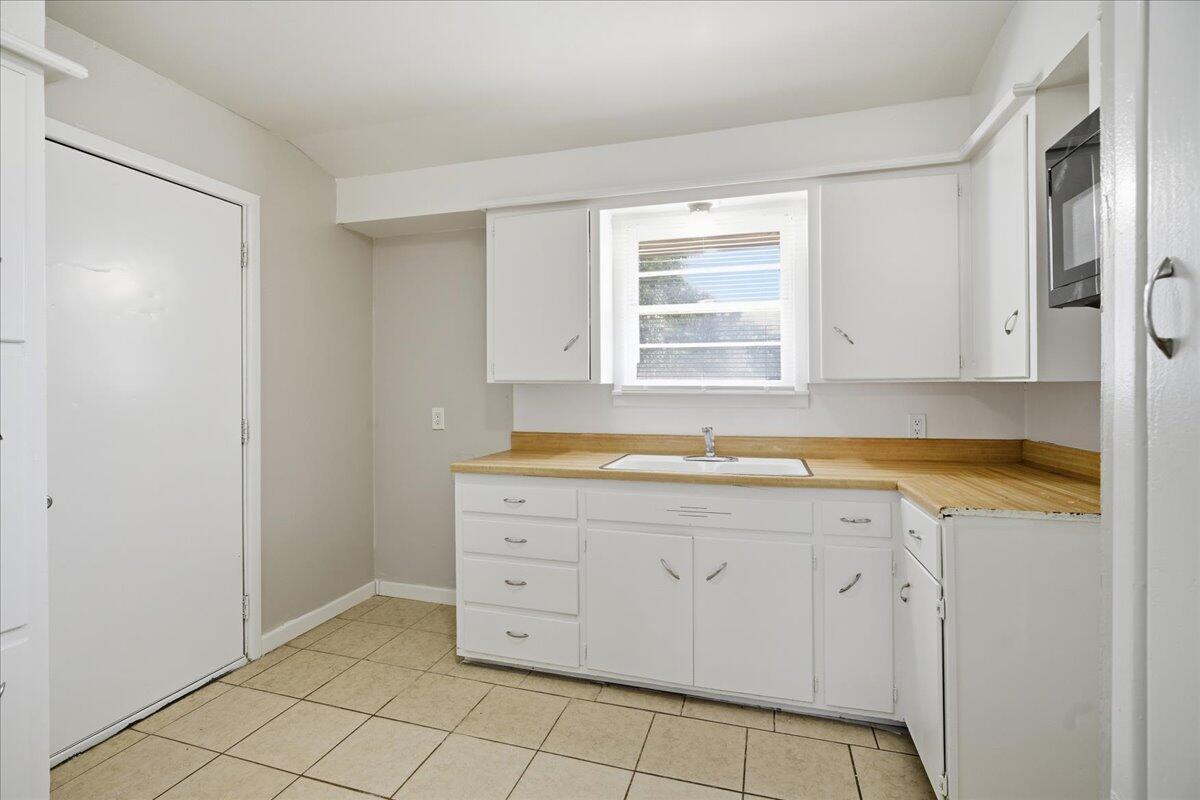 3816 44th Street Lubbock, TX 79413 - Photo 28 of 36 a view of a kitchen with a sink