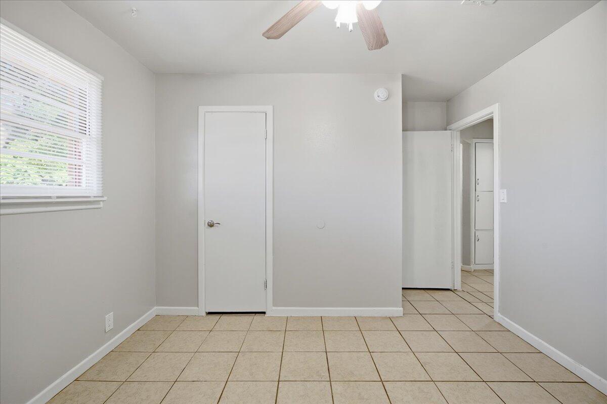 3816 44th Street Lubbock, TX 79413 - Photo 33 of 36 an empty room with chandelier fan