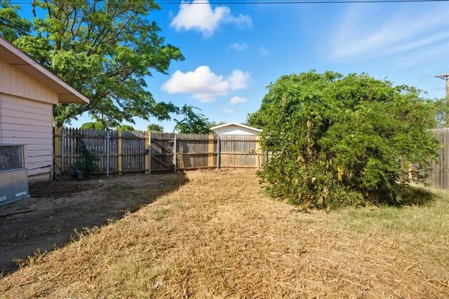 a view of backyard with green space