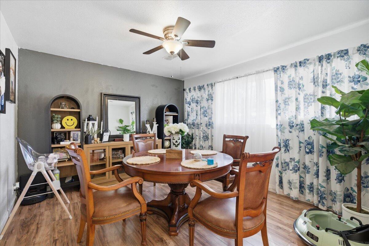 3816 44th Street Lubbock, TX 79413 - Photo 7 of 36 a view of a dining room with furniture and a potted plant