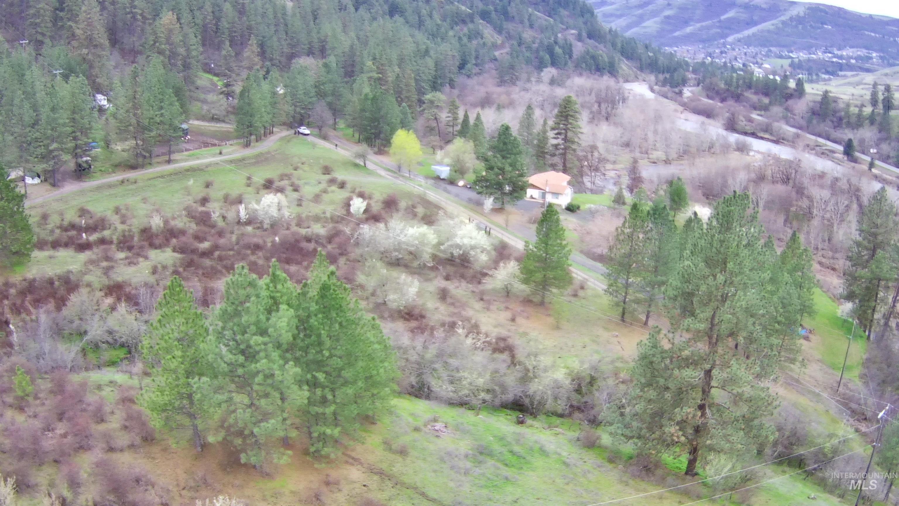Aerial view of sparsely populated area with a mountain backdrop