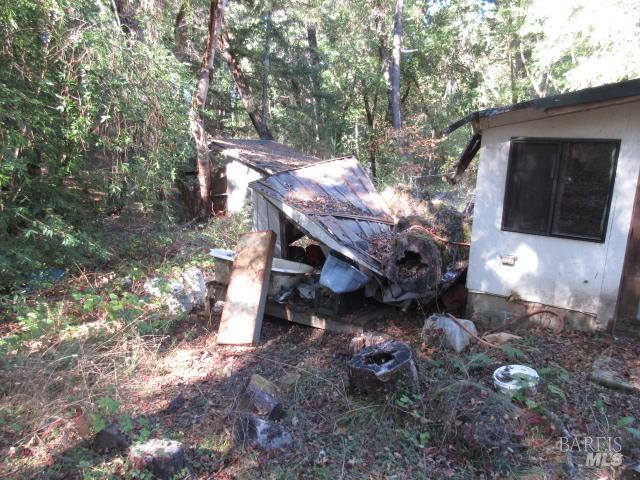 20515 Fort Ross Road Cazadero, CA 95421 - Photo 13 of 17 a view of a house with a yard and sitting area