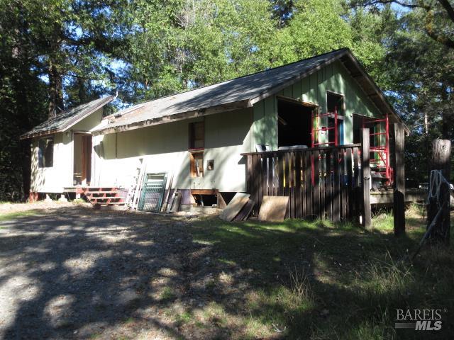 20515 Fort Ross Road Cazadero, CA 95421 - Photo 14 of 17 a view of a house with backyard and sitting area