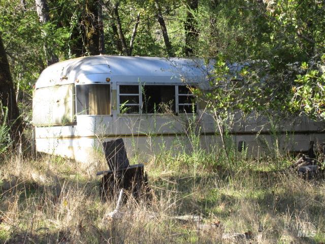 20515 Fort Ross Road Cazadero, CA 95421 - Photo 15 of 17 a view of a house with a yard and sitting area