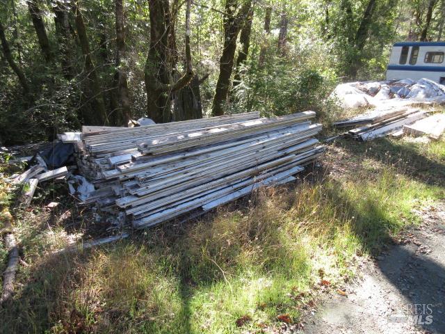 20515 Fort Ross Road Cazadero, CA 95421 - Photo 7 of 17 a view of a yard with wooden fence
