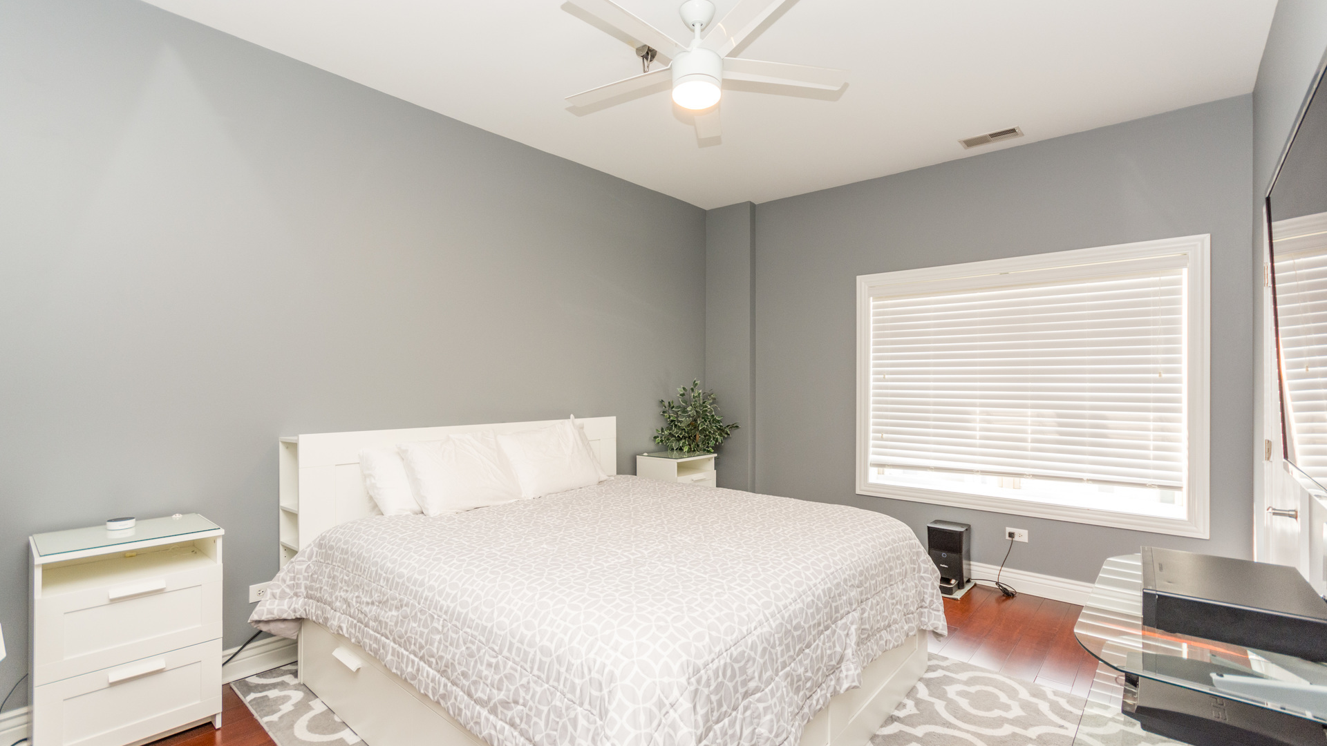 1155 West Roosevelt Road, Unit 401 Chicago, IL 60608 - Photo 14 of 35 a bedroom with a bed and a window