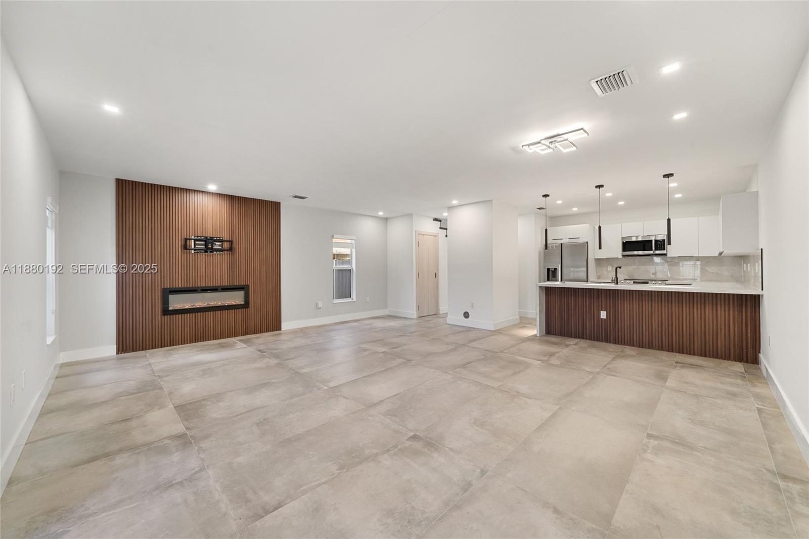 3431 Southwest 16th Terrace Miami, FL 33145 - Photo 12 of 33 a view of an empty room with a kitchen