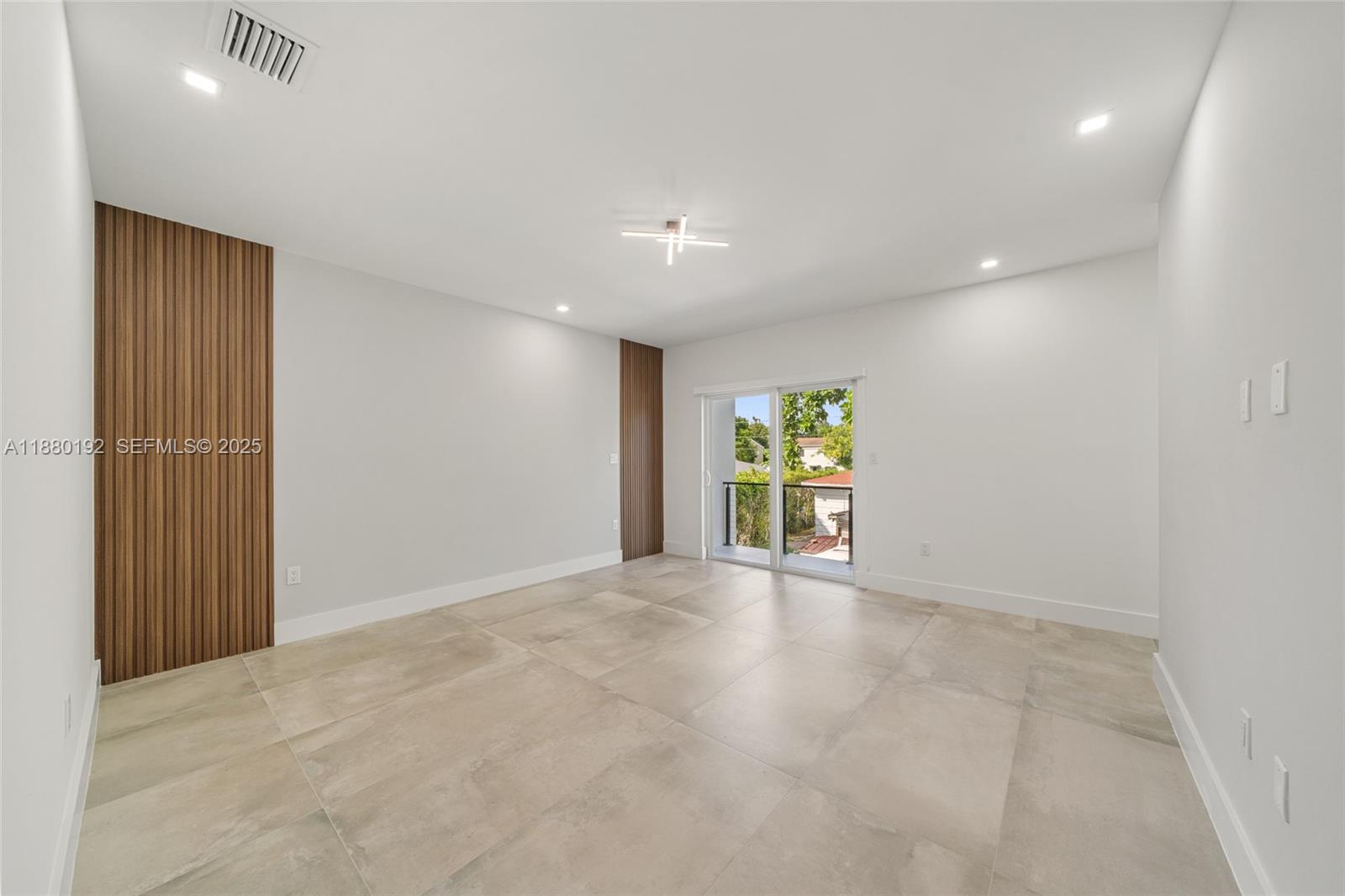 3431 Southwest 16th Terrace Miami, FL 33145 - Photo 16 of 33 a view of an empty room with a window