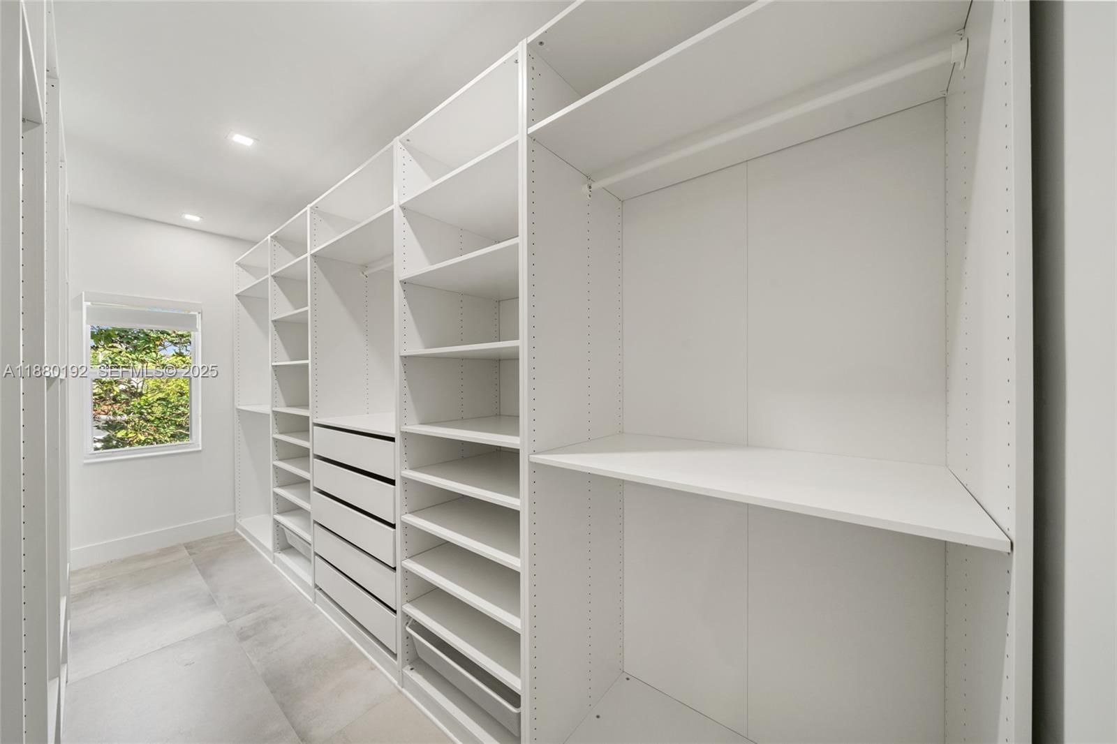 3431 Southwest 16th Terrace Miami, FL 33145 - Photo 19 of 33 a view of walk in closet with empty racks