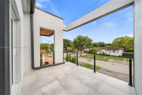 a view of entrance gate with wooden fence