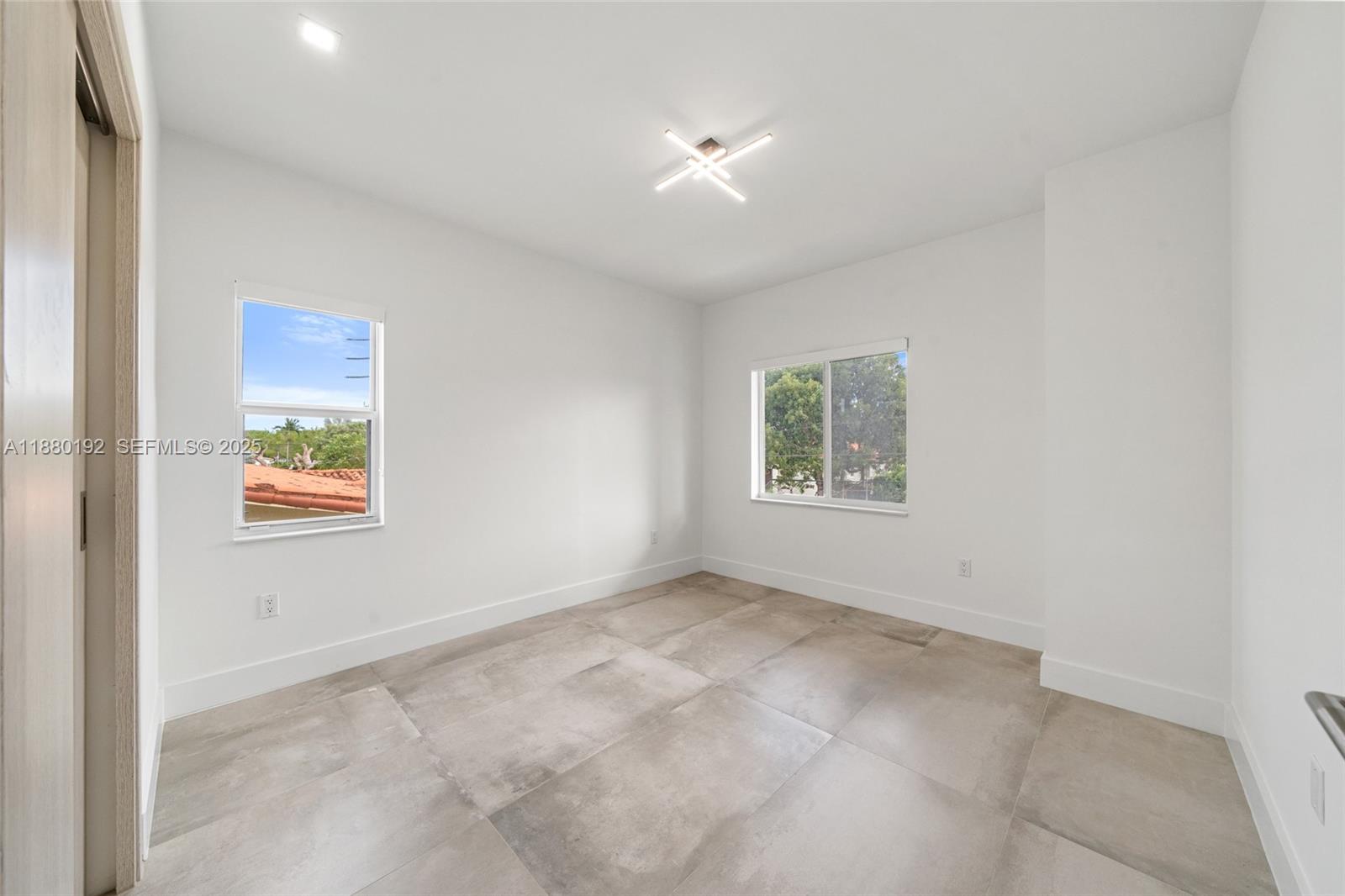 3431 Southwest 16th Terrace Miami, FL 33145 - Photo 24 of 33 an empty room with windows