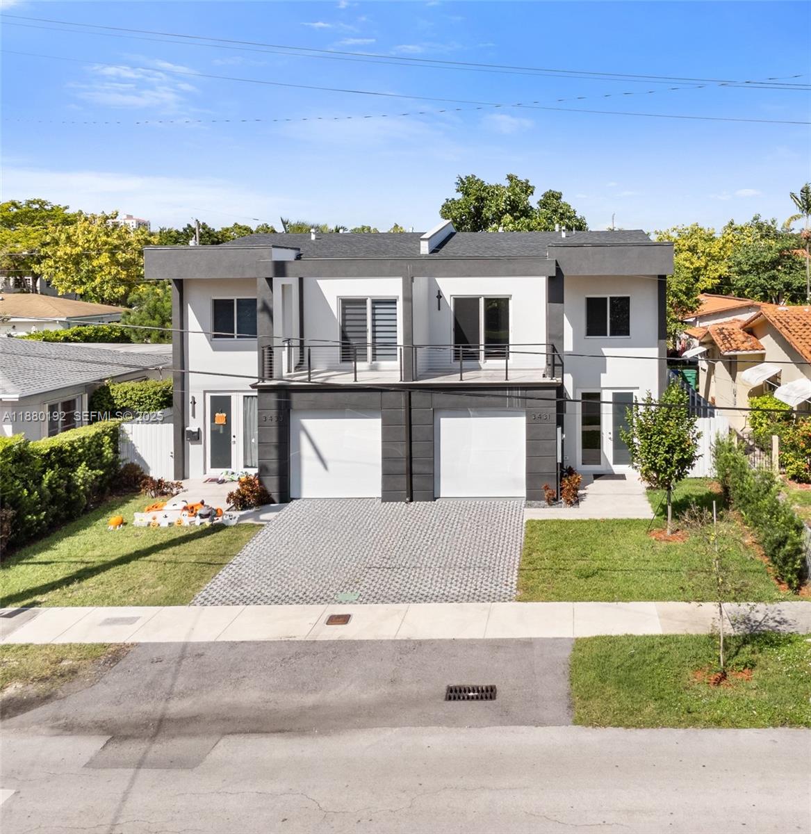 3431 Southwest 16th Terrace Miami, FL 33145 - Photo 3 of 33 front view of a house with a yard