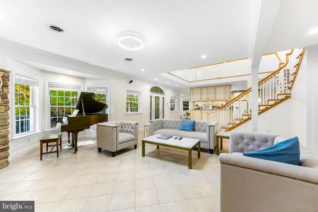 a living room with furniture and a table