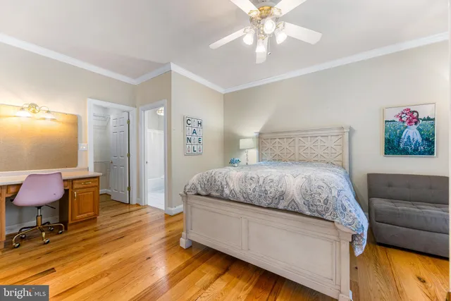 a spacious bedroom with a bed and a couch