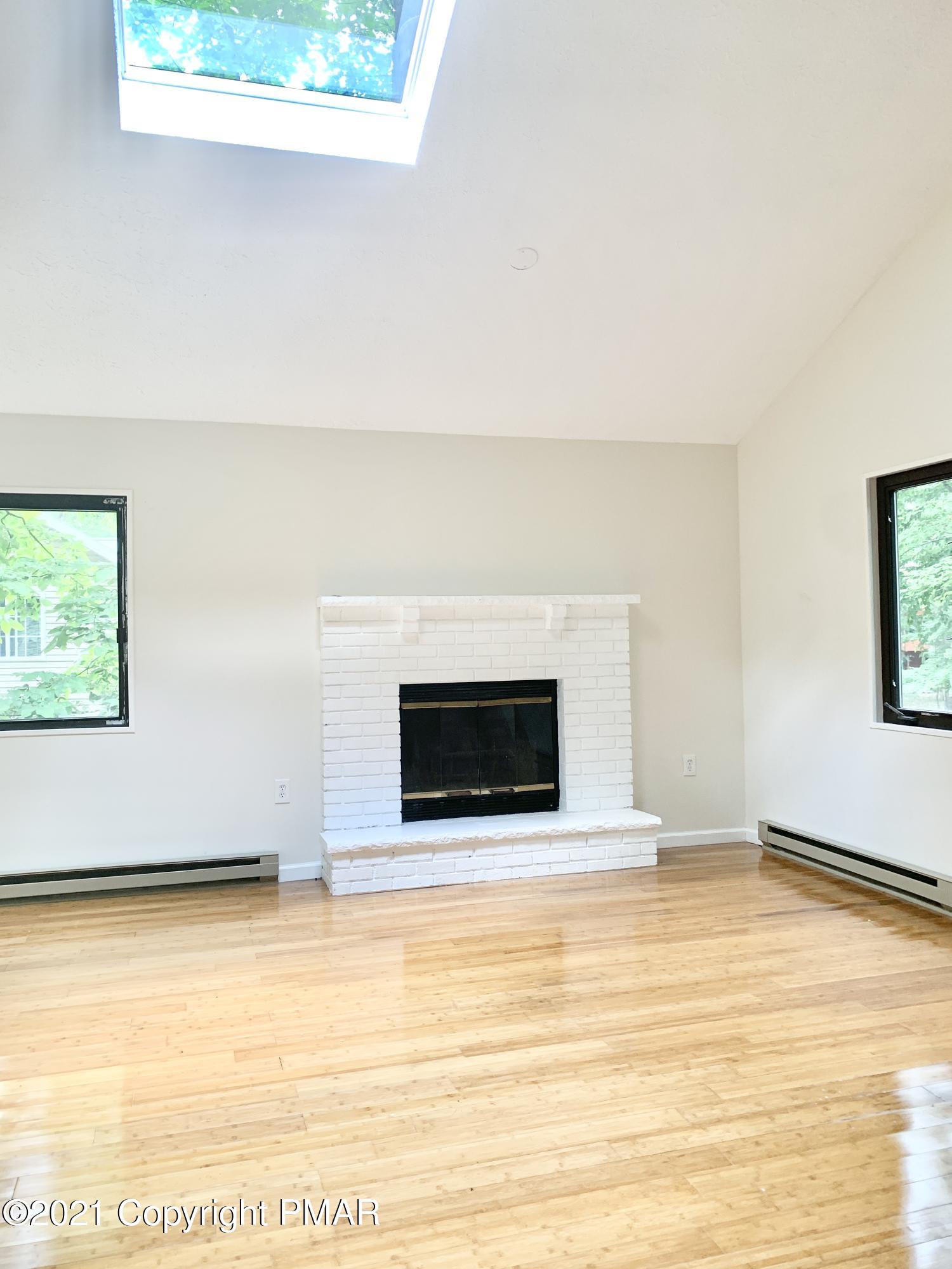 185 Canterbury Road Bushkill, PA 18324 - Photo 8 of 27 a white building with a outdoor space