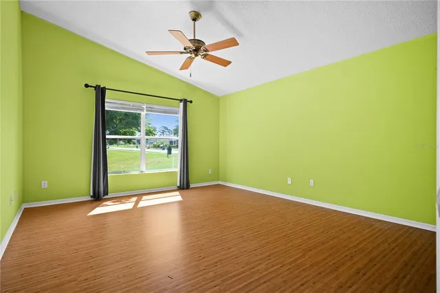 a view of room with window and ceiling fan