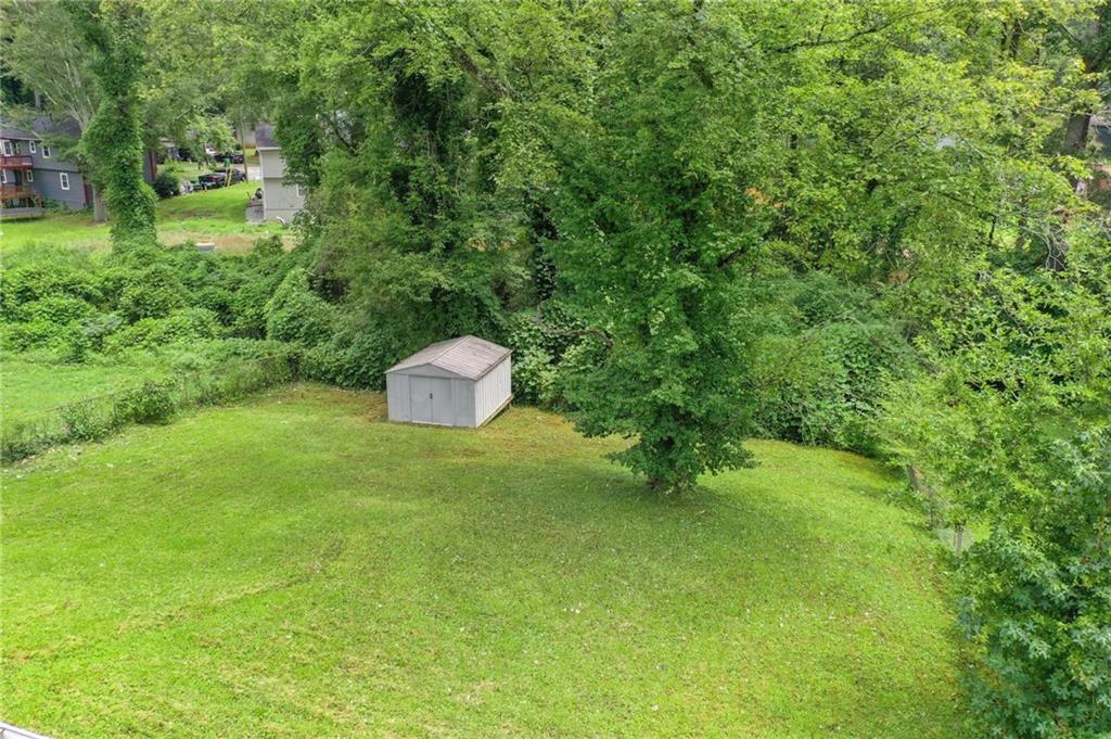 799 Pine Roc Drive Stone Mountain, GA 30083 - Photo 30 of 30 a backyard of a house with a yard and entertaining space
