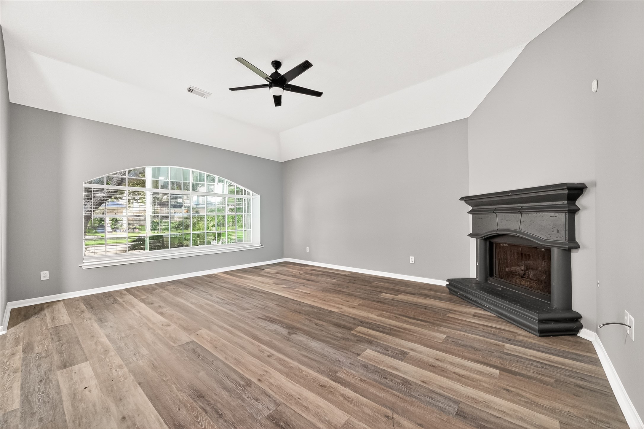23810 Spring Way Drive Spring, TX 77373 - Photo 4 of 35 wooden floor fireplace and windows in a room