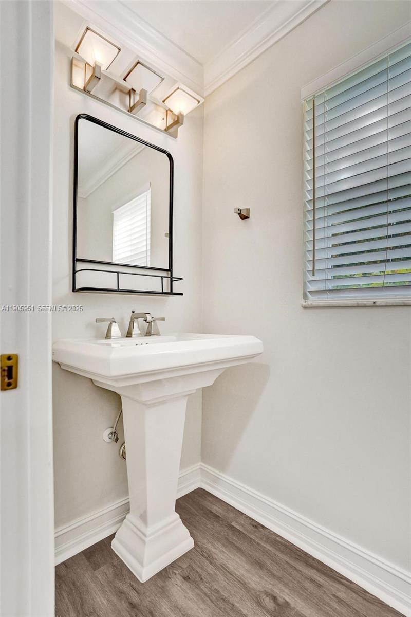 3801 Northwest 27th Avenue Boca Raton, FL 33434 - Photo 27 of 100 a bathroom with a sink mirror and vanity