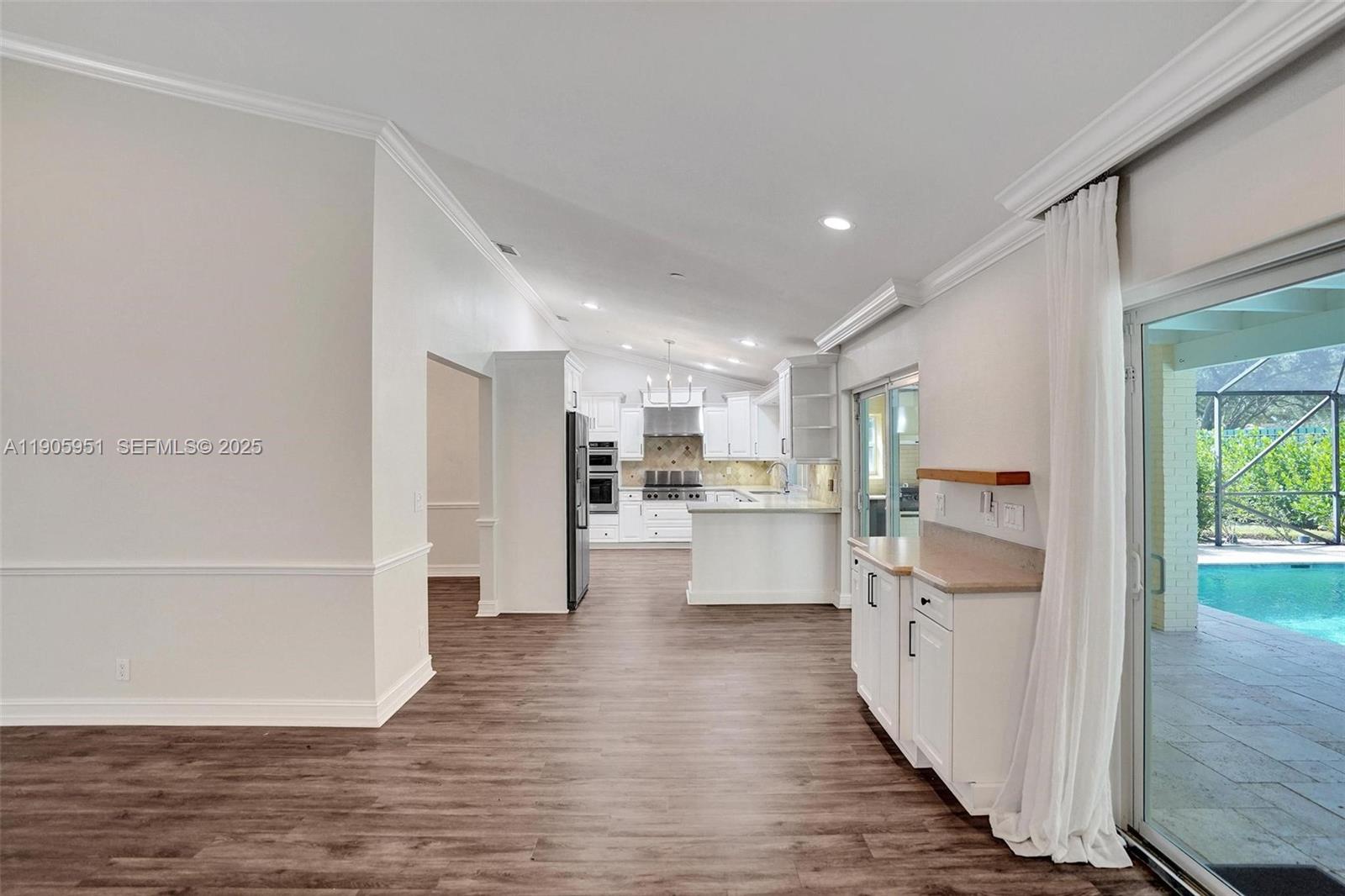 3801 Northwest 27th Avenue Boca Raton, FL 33434 - Photo 44 of 100 a view of kitchen with wooden floor