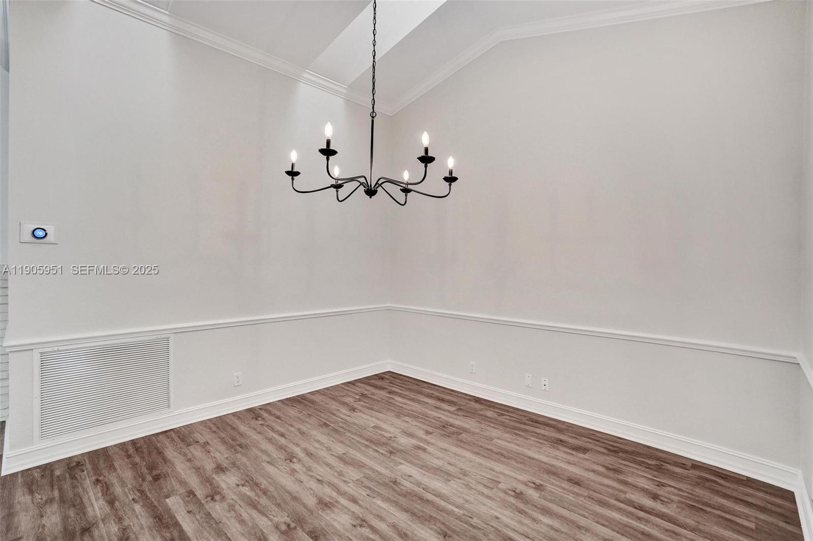 3801 Northwest 27th Avenue Boca Raton, FL 33434 - Photo 45 of 100 a view of an empty room with wooden floor