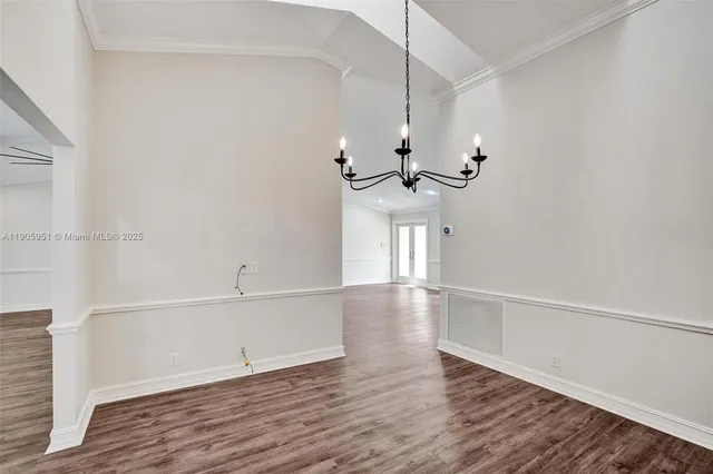 an aerial view of a house with a yard and garden